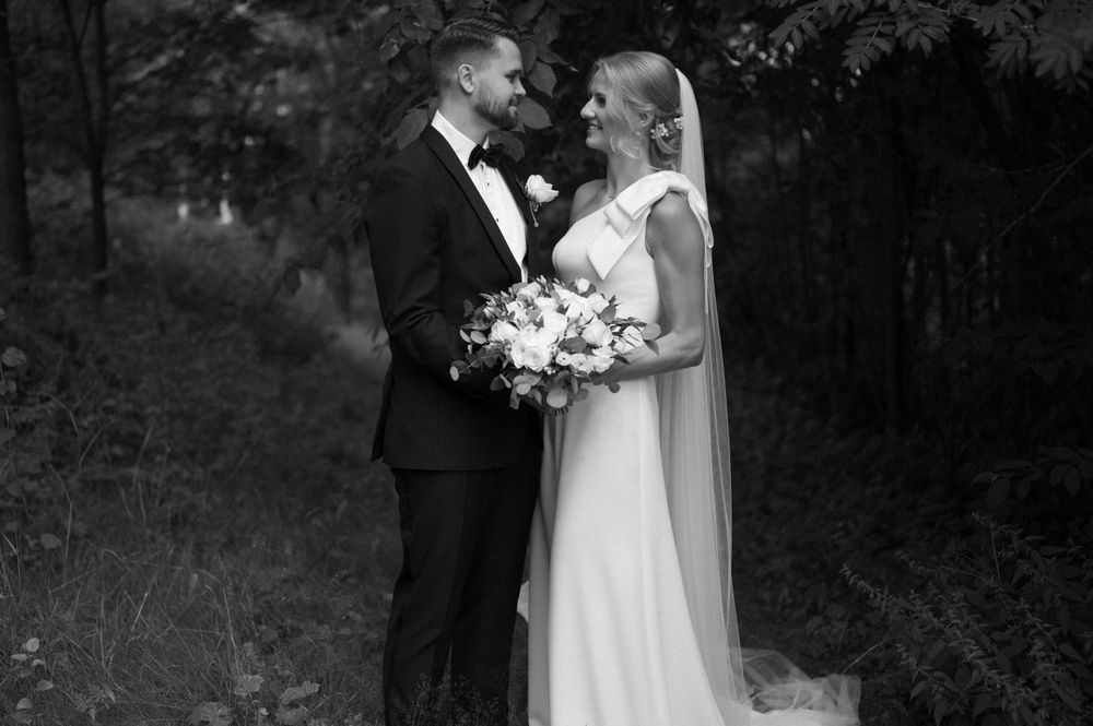 Artistic black and white wedding sequence showing romantic couple's interactions.