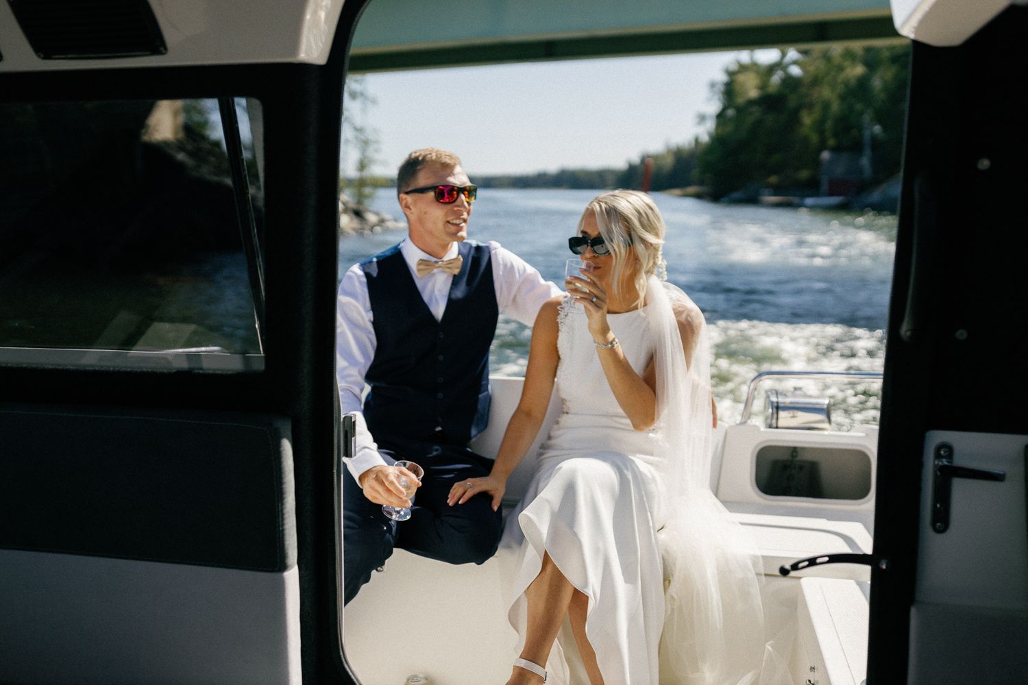Couple sharing a moment on a luxury boat during a summer celebration.