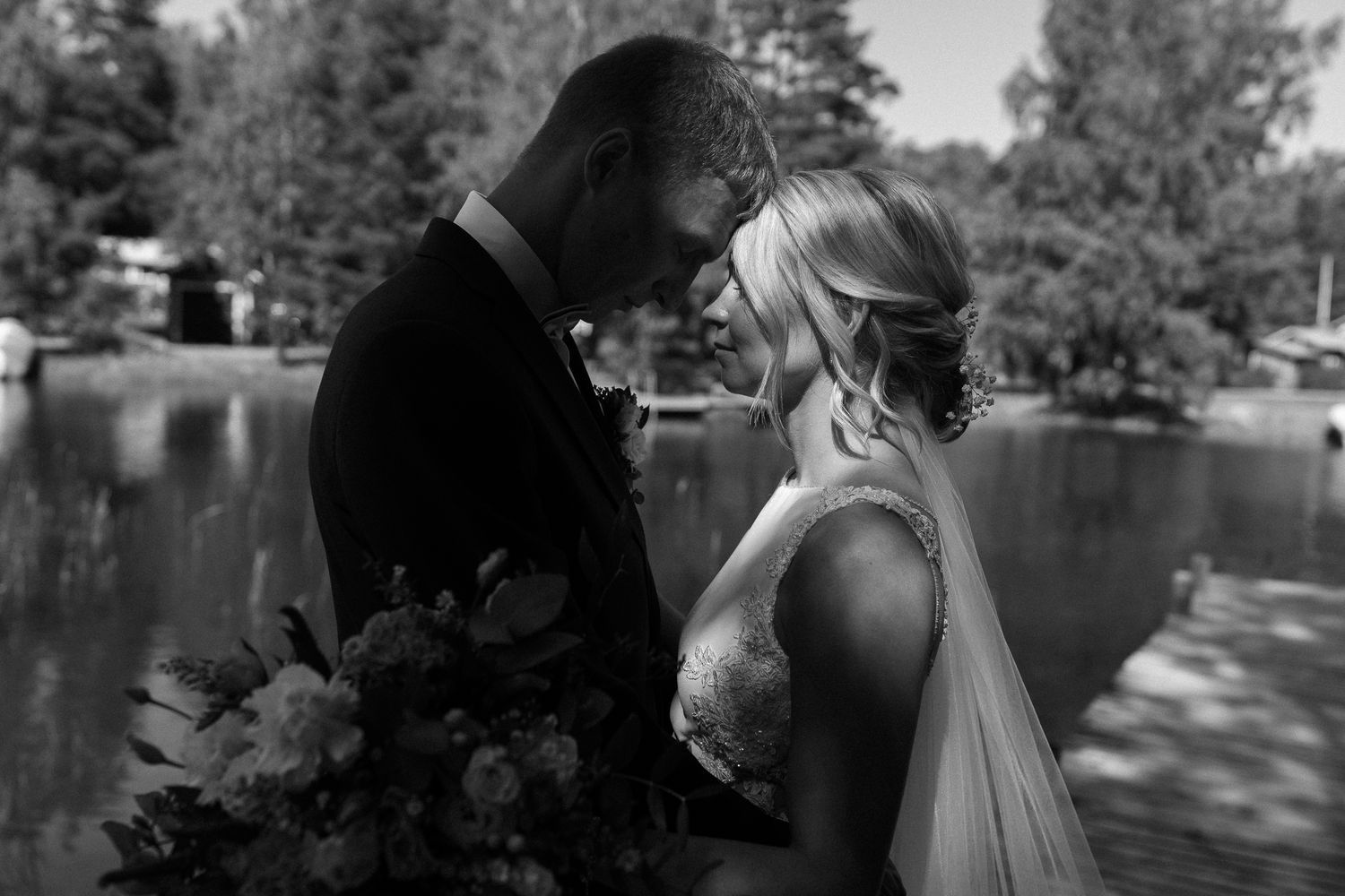 Black and white wedding portraits in a series showing intimate moments.