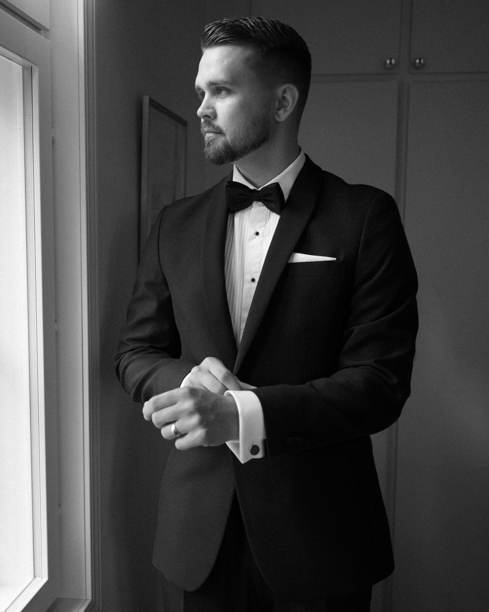 Formal attire detail shots in dramatic black and white lighting.