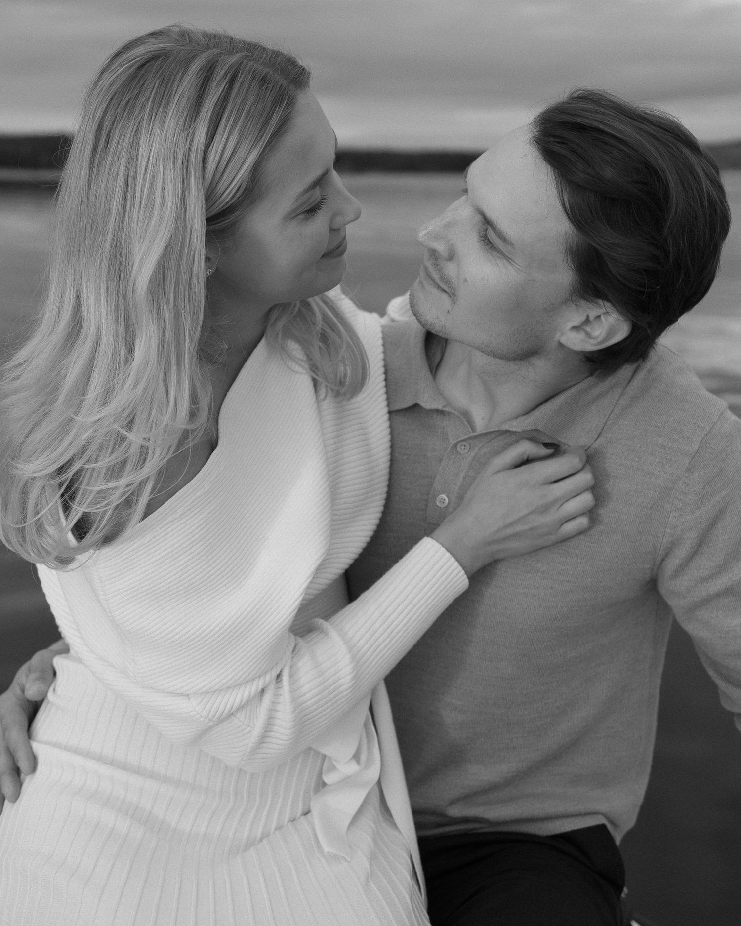 Black and white portraits capturing tender moments between two people.