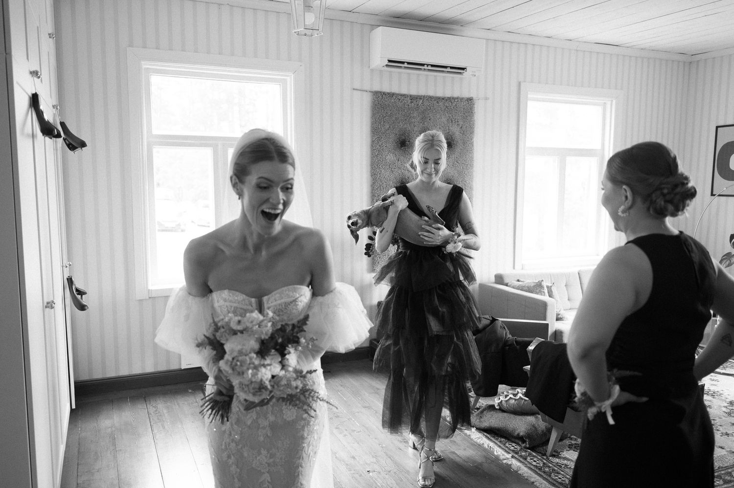 Wedding preparations in a bright white room with formal attire and preparations underway.