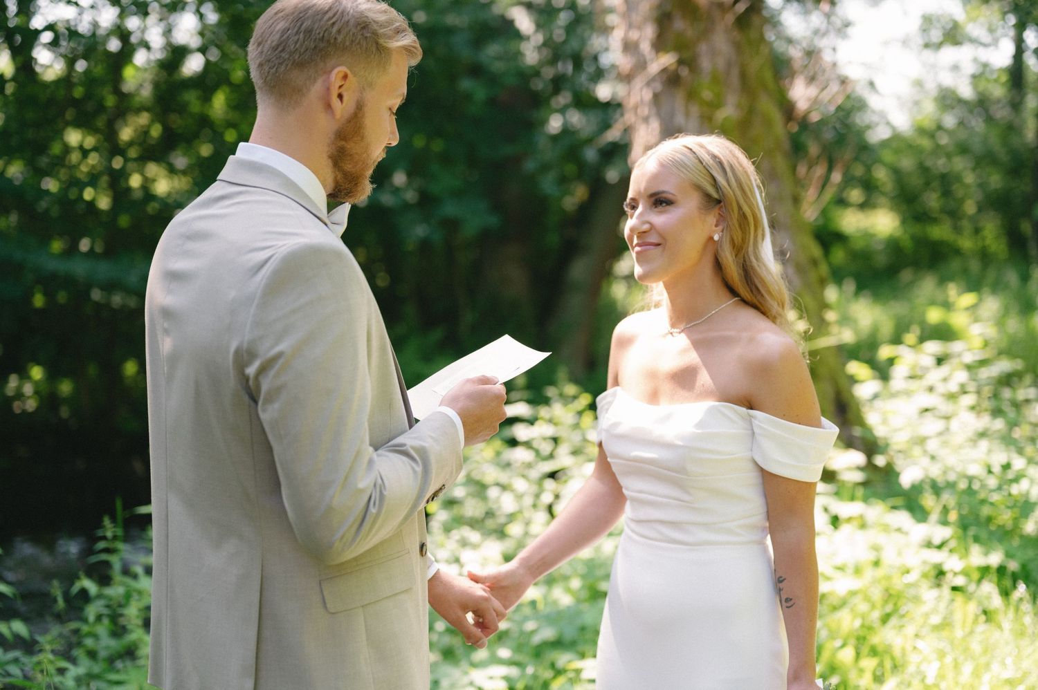 Romantic garden wedding sequence with natural sunlight filtering through trees.