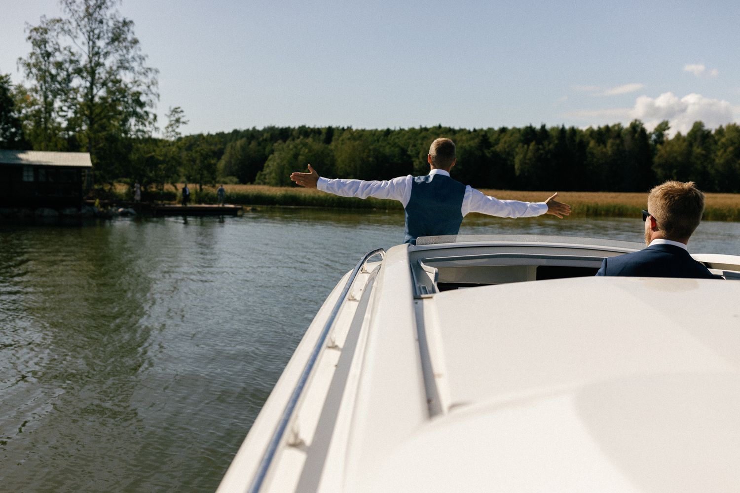 Just Married banner decorates white classic car hood.
