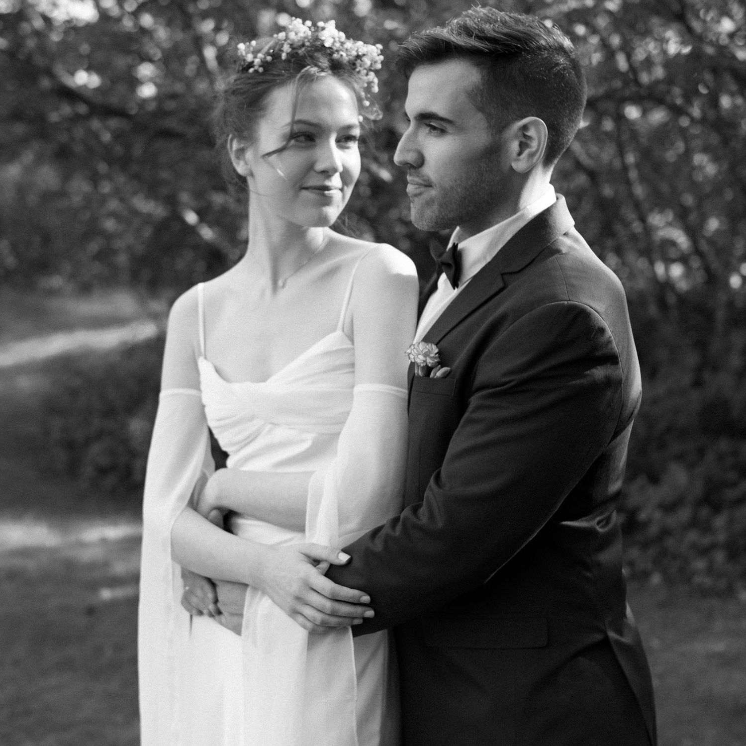 Romantic black and white wedding photo sequence showing tender embraces.
