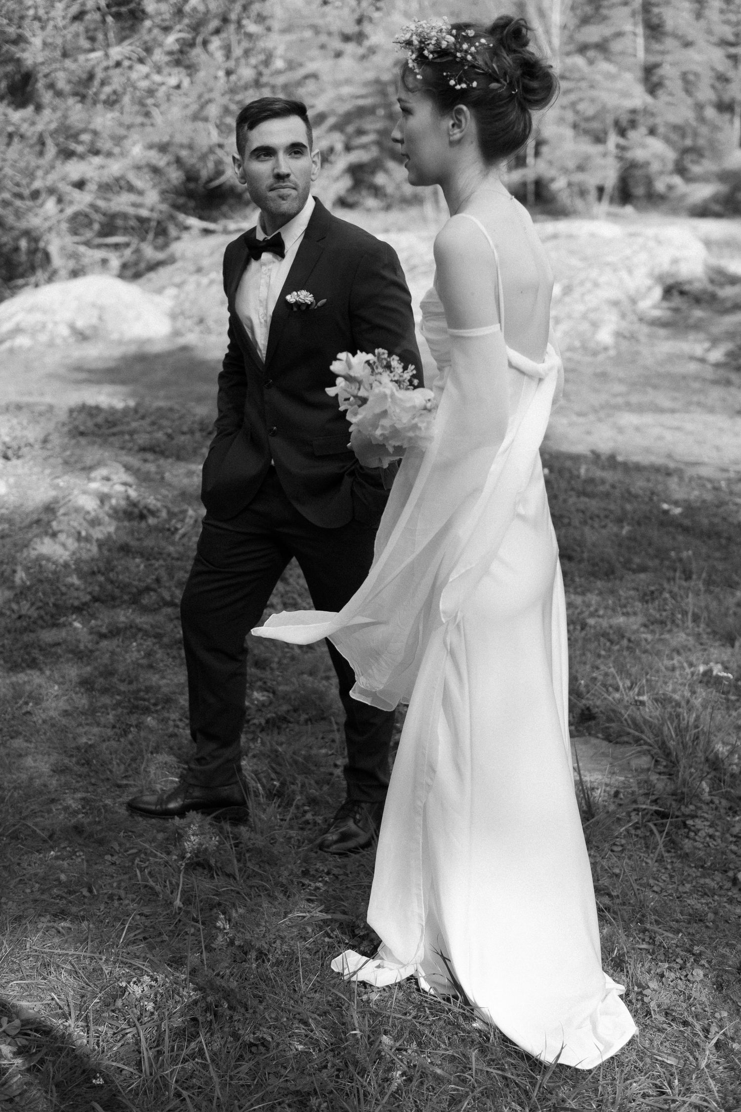 Black and white wedding photos captured in a natural outdoor setting.