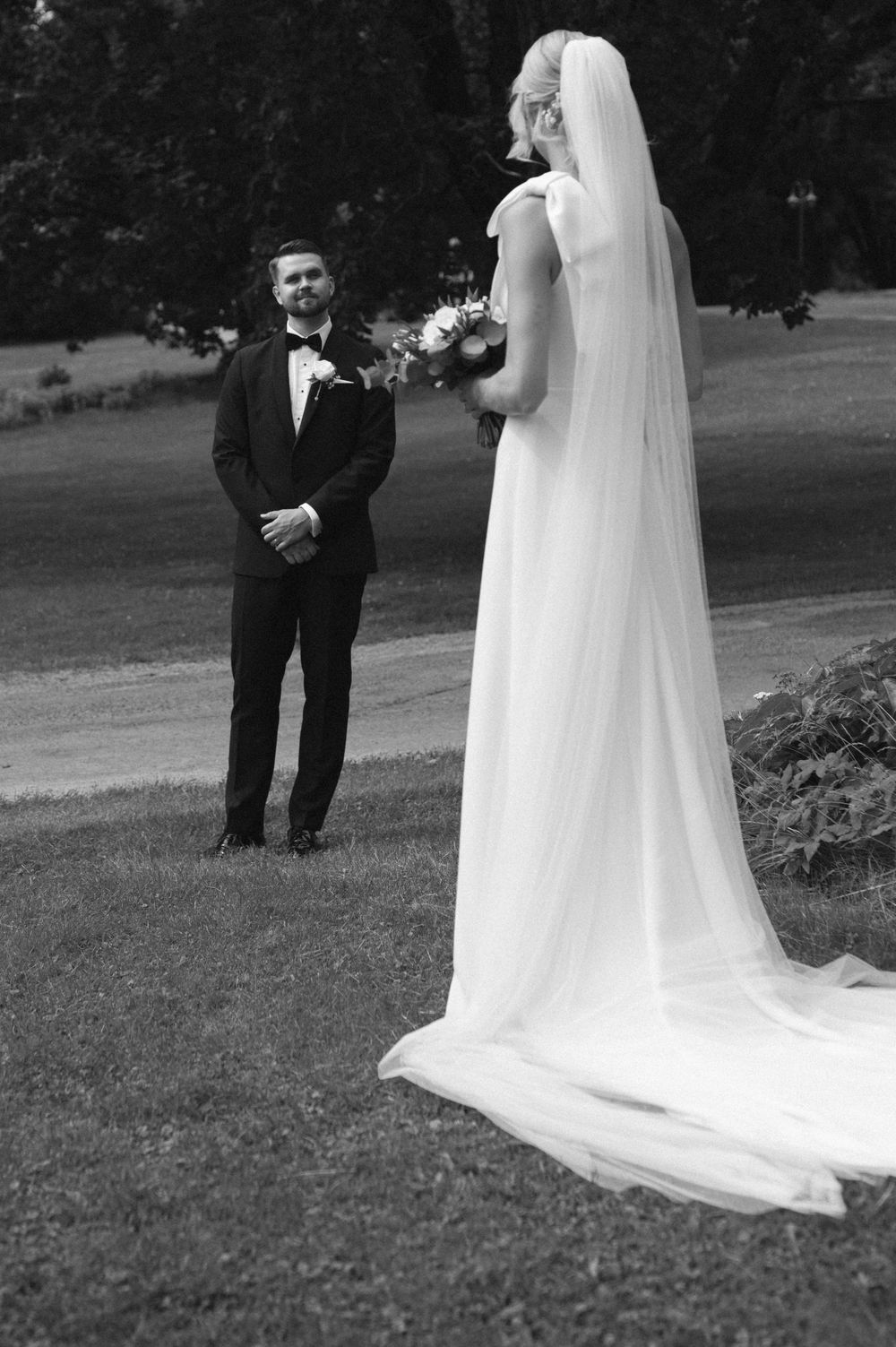 Black and white wedding portraits showing couple's silhouettes against a natural outdoor setting.
