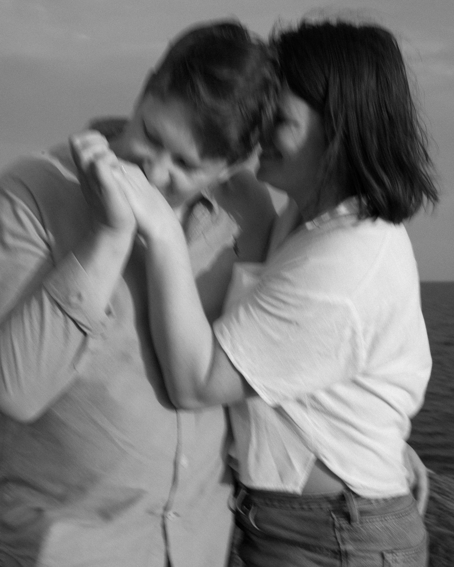 A series of intimate dance movements in black and white showing two people in close embrace.
