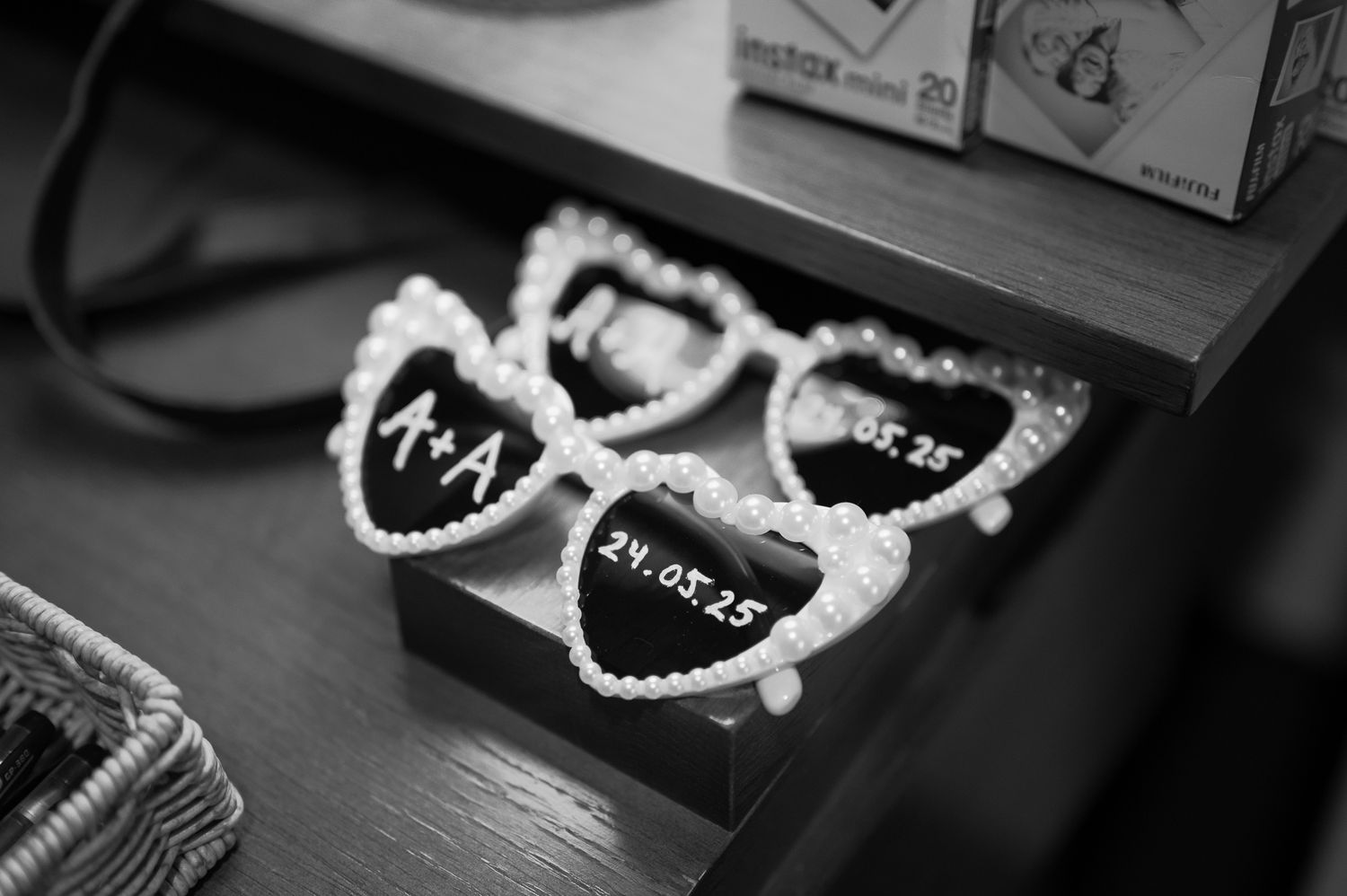 Black and white photo of dental retainers and orthodontic appliances displayed in a row.