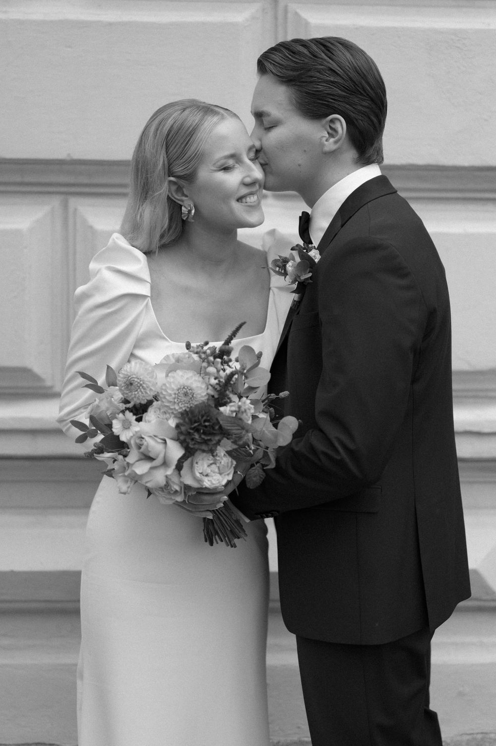 Black and white romantic wedding portraits showing tender moments between newlyweds.