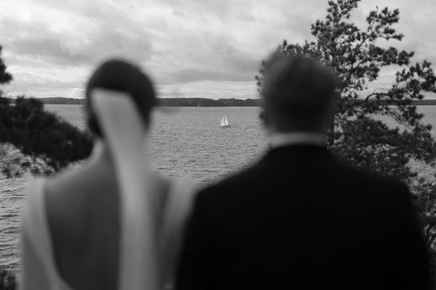 A black and white photo montage of people enjoying a day at the beach and lake.