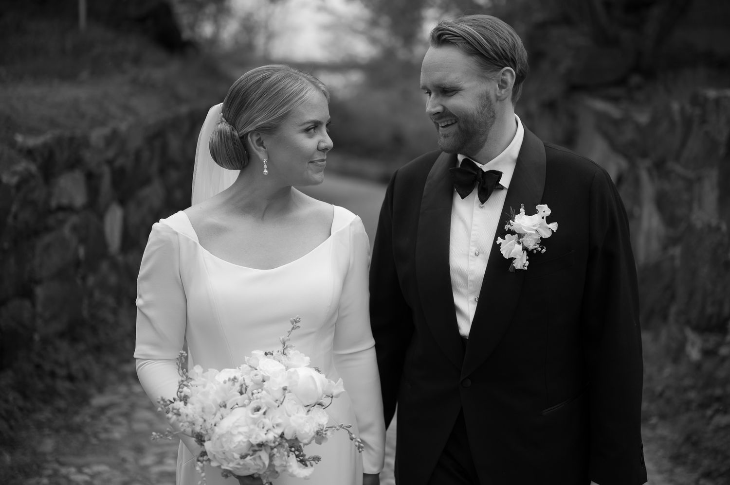 A series of black and white wedding photographs showing tender moments between a bride and groom.