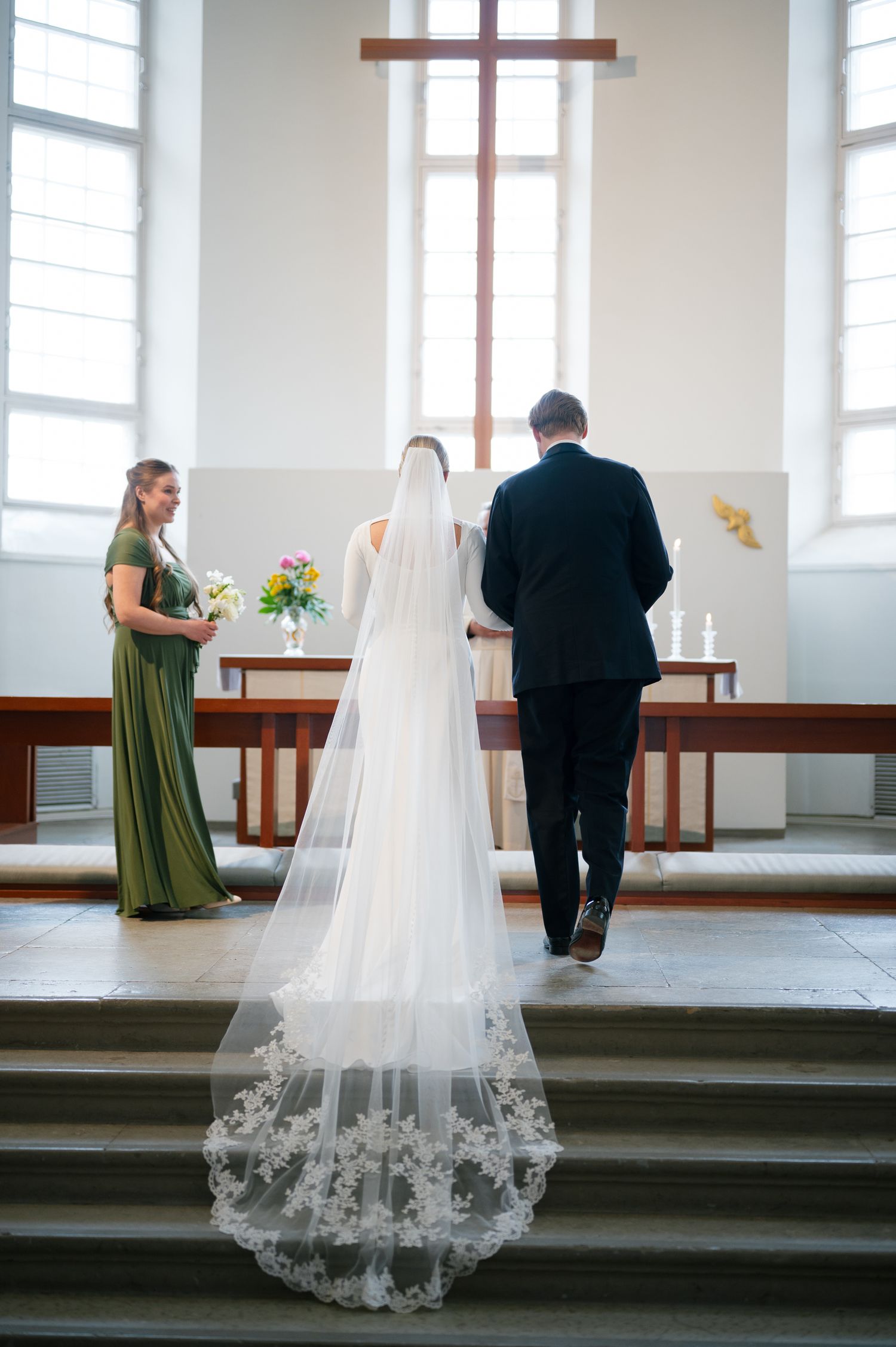 A sequence of wedding ceremony photos showing a bride's lace veil and figures standing at a church altar.