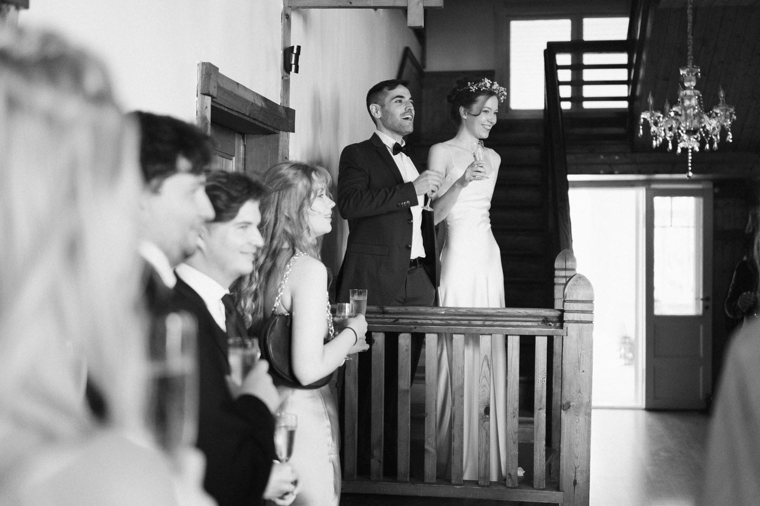 Black and white photos capture intimate moments during a wedding celebration.