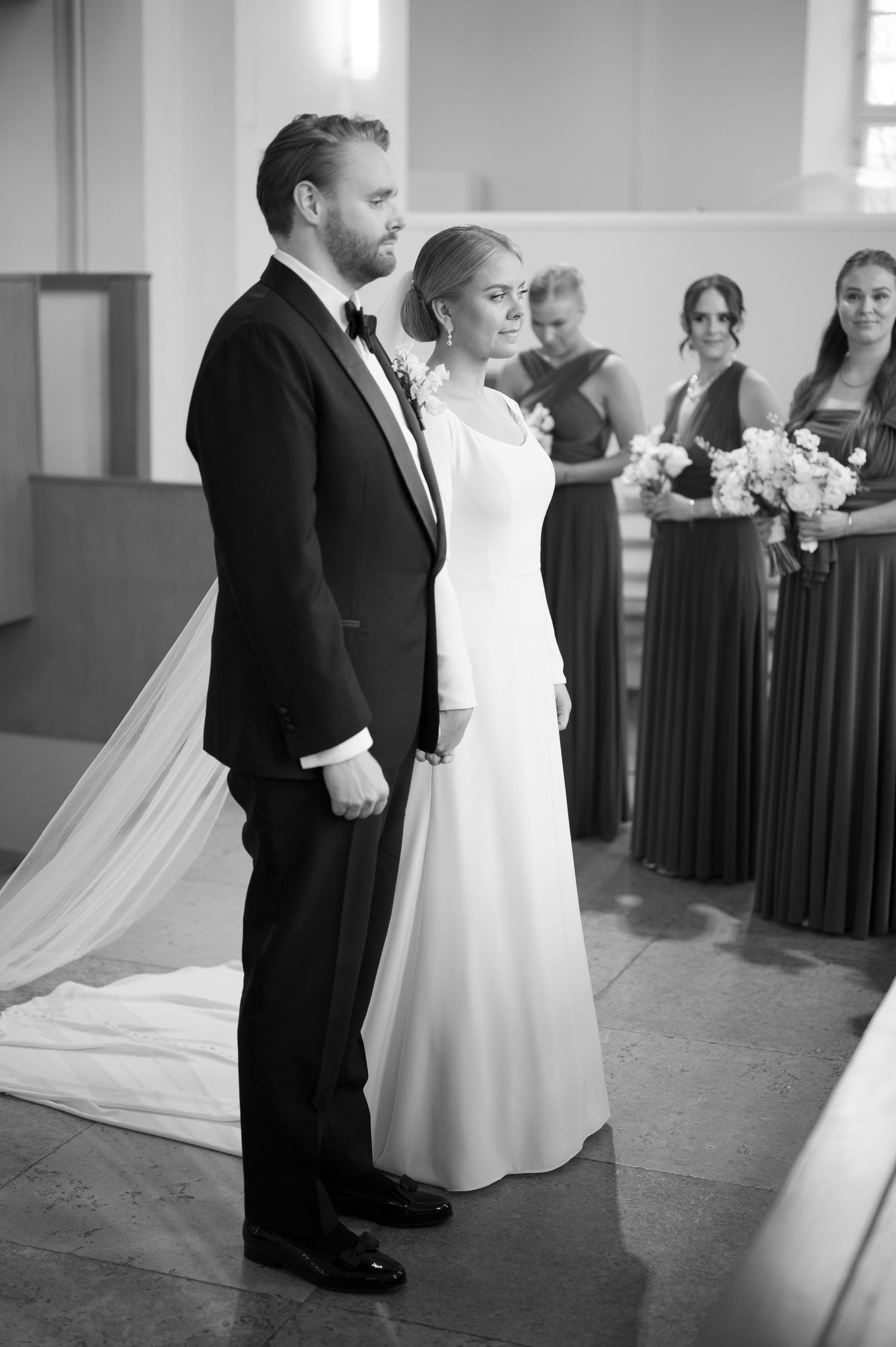 Black and white wedding photo series showing couple dancing together in elegant formal attire with flowing white dress.