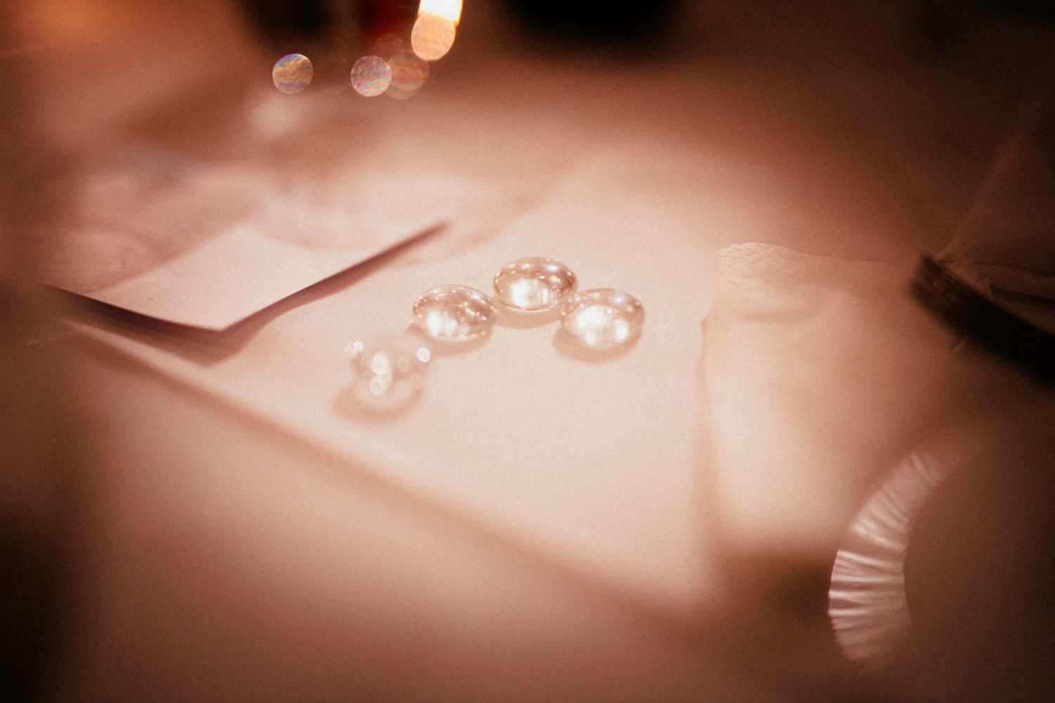 Soft bokeh lights create a romantic ambiance at an evening celebration.