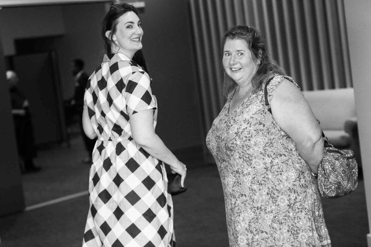 Two people dance together in a black and white photograph showing vintage 1950s style clothing and hairstyles.