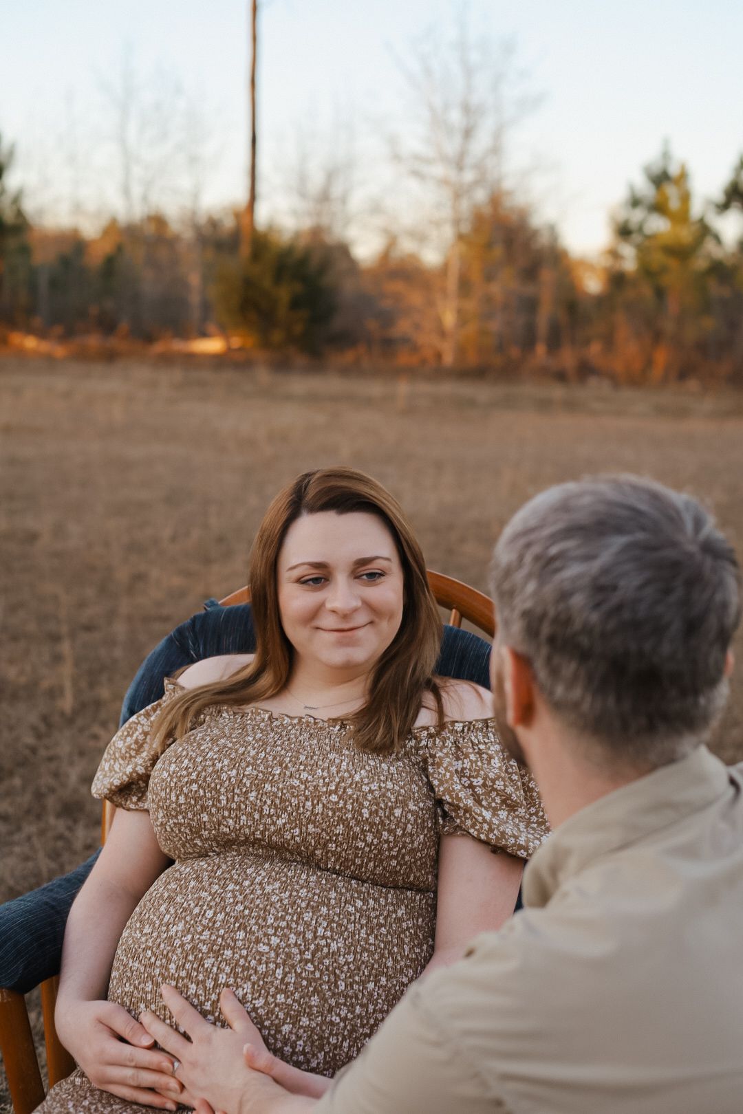 Maternity picture of a couple in a field. Marianna Florida photography.