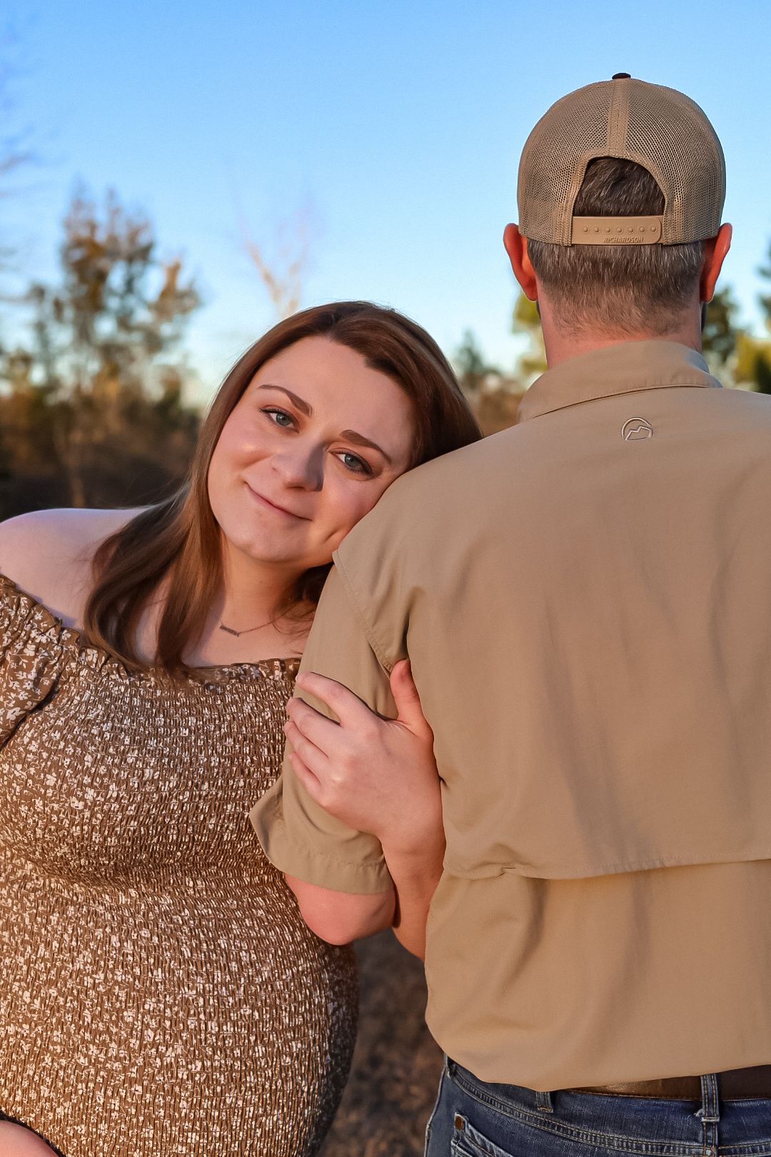 Maternity picture of a couple in a field. Marianna Florida photography.