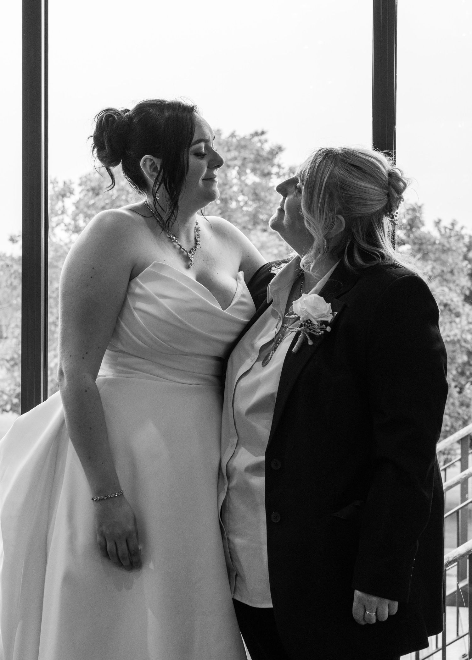 Emotional black-and-white photograph of Cortney sharing a quiet moment with her mother on her wedding day.