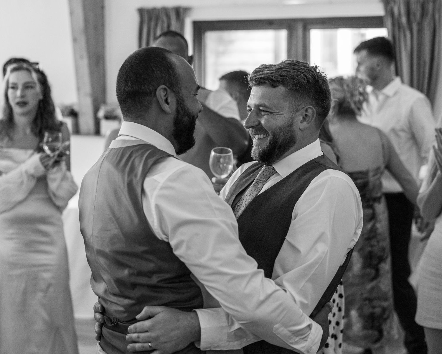 Jack and Aaron sharing a drunken embrace on the dance floor at Rock Village Hall in Worcestershire.