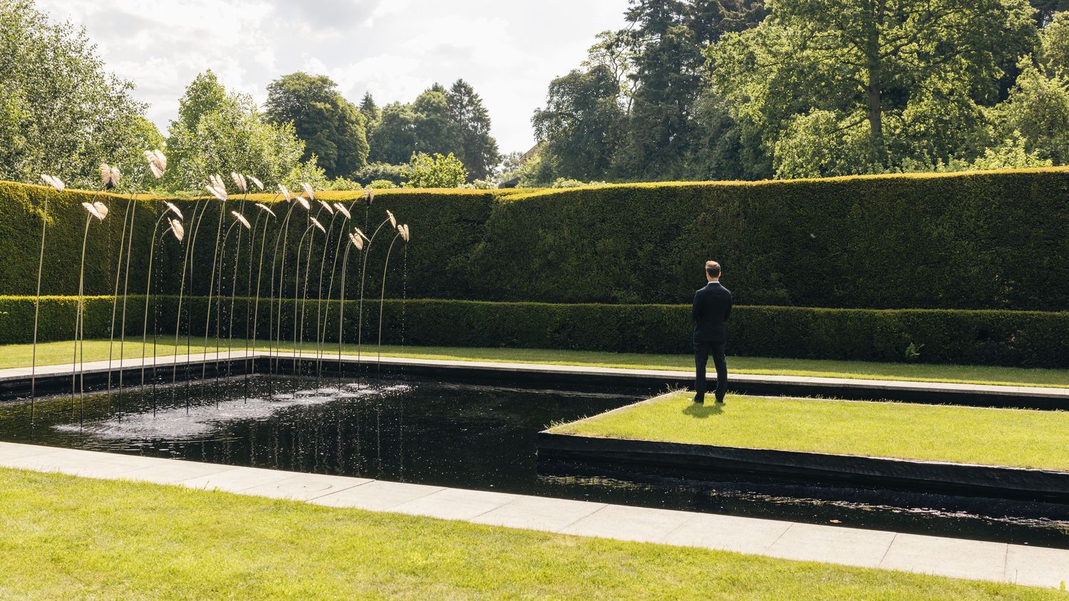 Emotional first look during a Cotswolds wedding at Kiftsgate Court Gardens