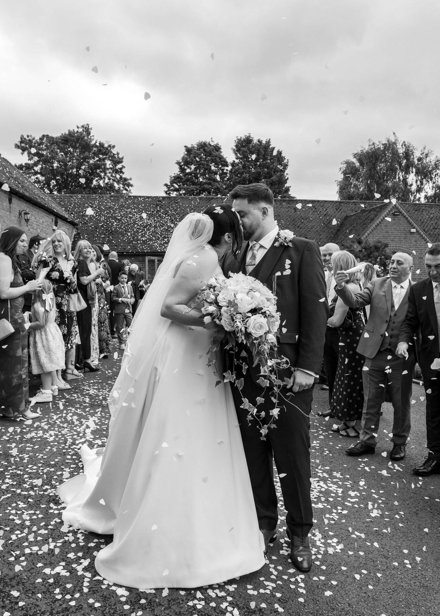 Cortney and Dan sharing an intimate moment together during their confetti throw on their wedding day at Windmill Village Hotel.