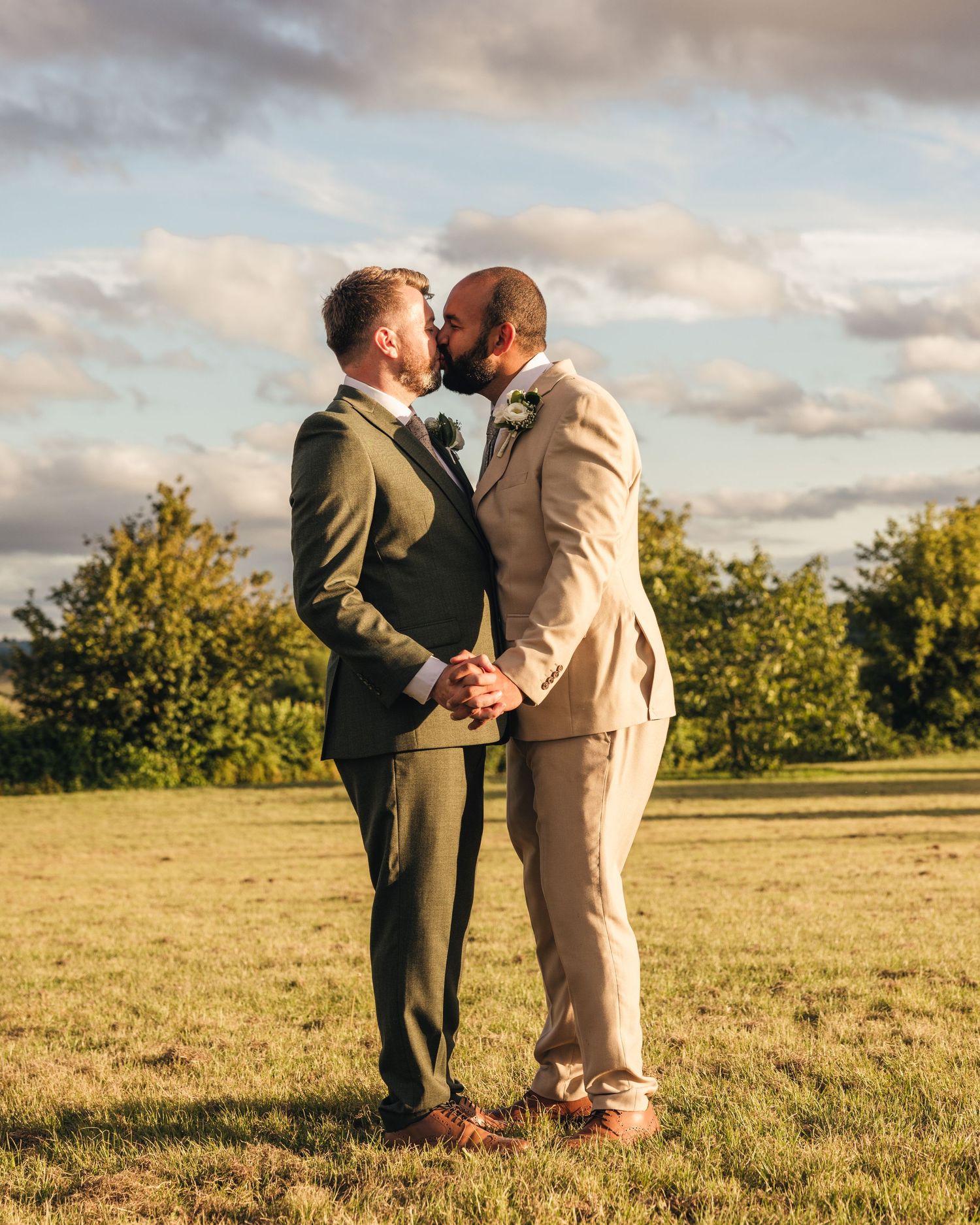 Aaron and Jack share a quiet moment together during golden-hour wedding portraits.