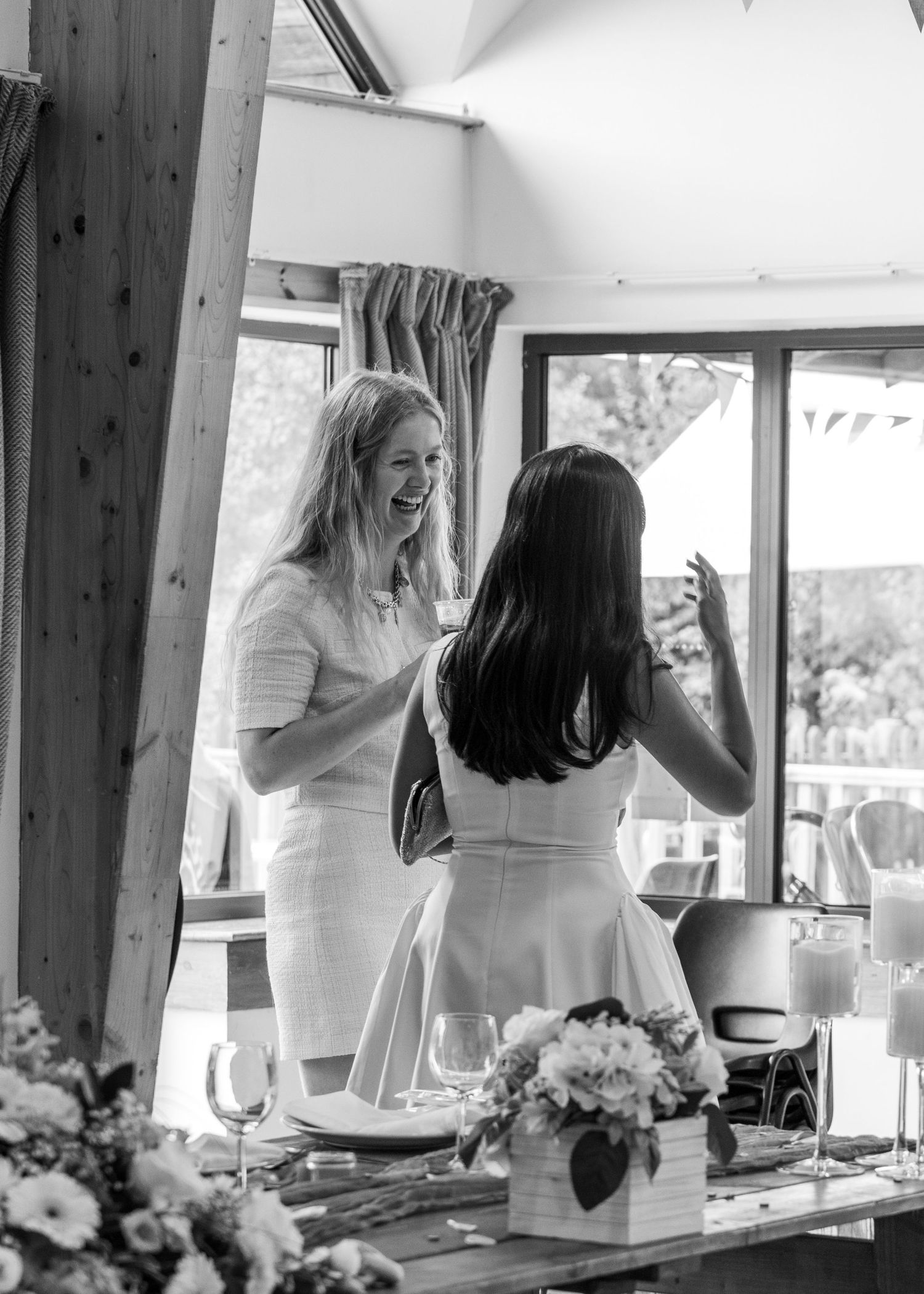 Some wedding guests enjoying a drink together before the ceremony starts.