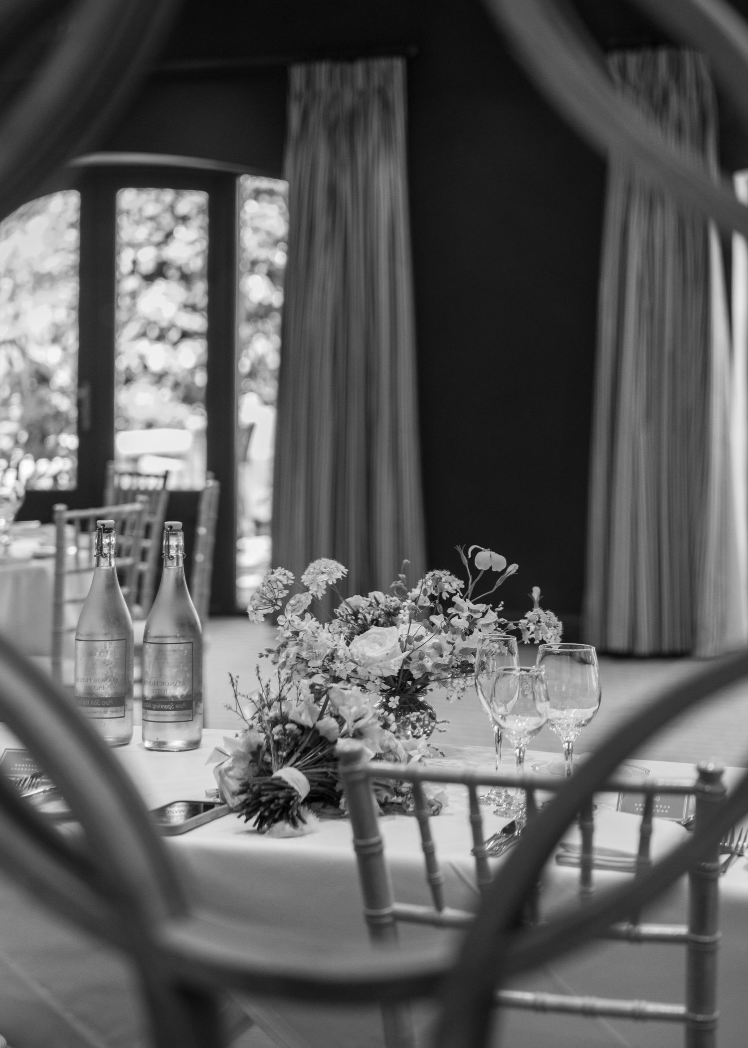 Wedding breakfast decoration set-up in black and white, captured by EvieSJPhotography.