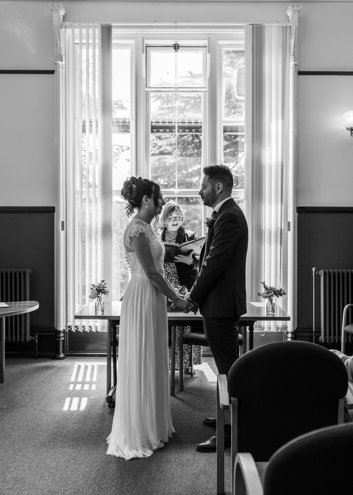 Bride and groom sharing a romantic moment on their wedding day, captured in a relaxed documentary style by EvieSJPhotography.