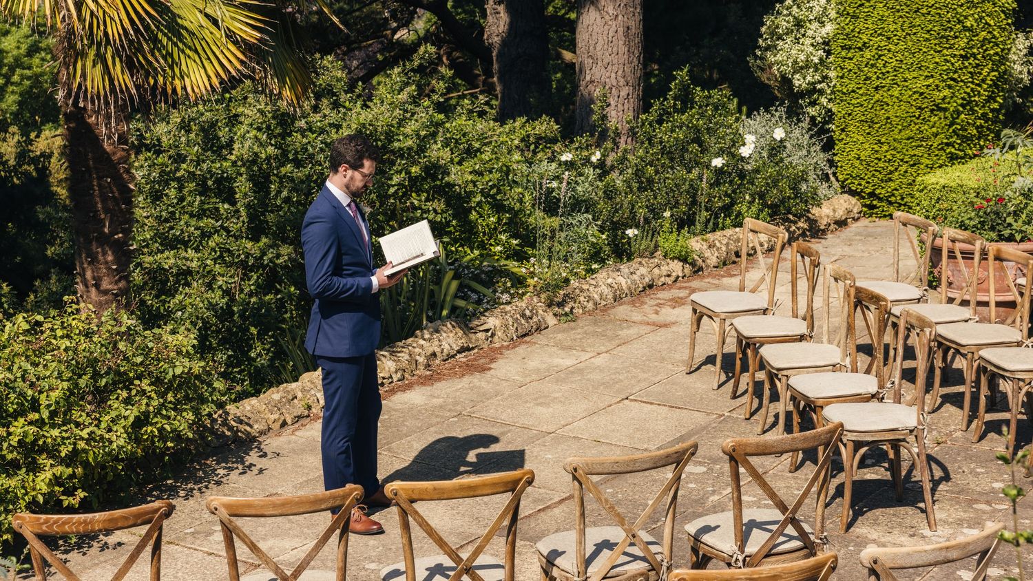 Outdoor wedding ceremony overlooking the Cotswold Hills at Kiftsgate Court Gardens