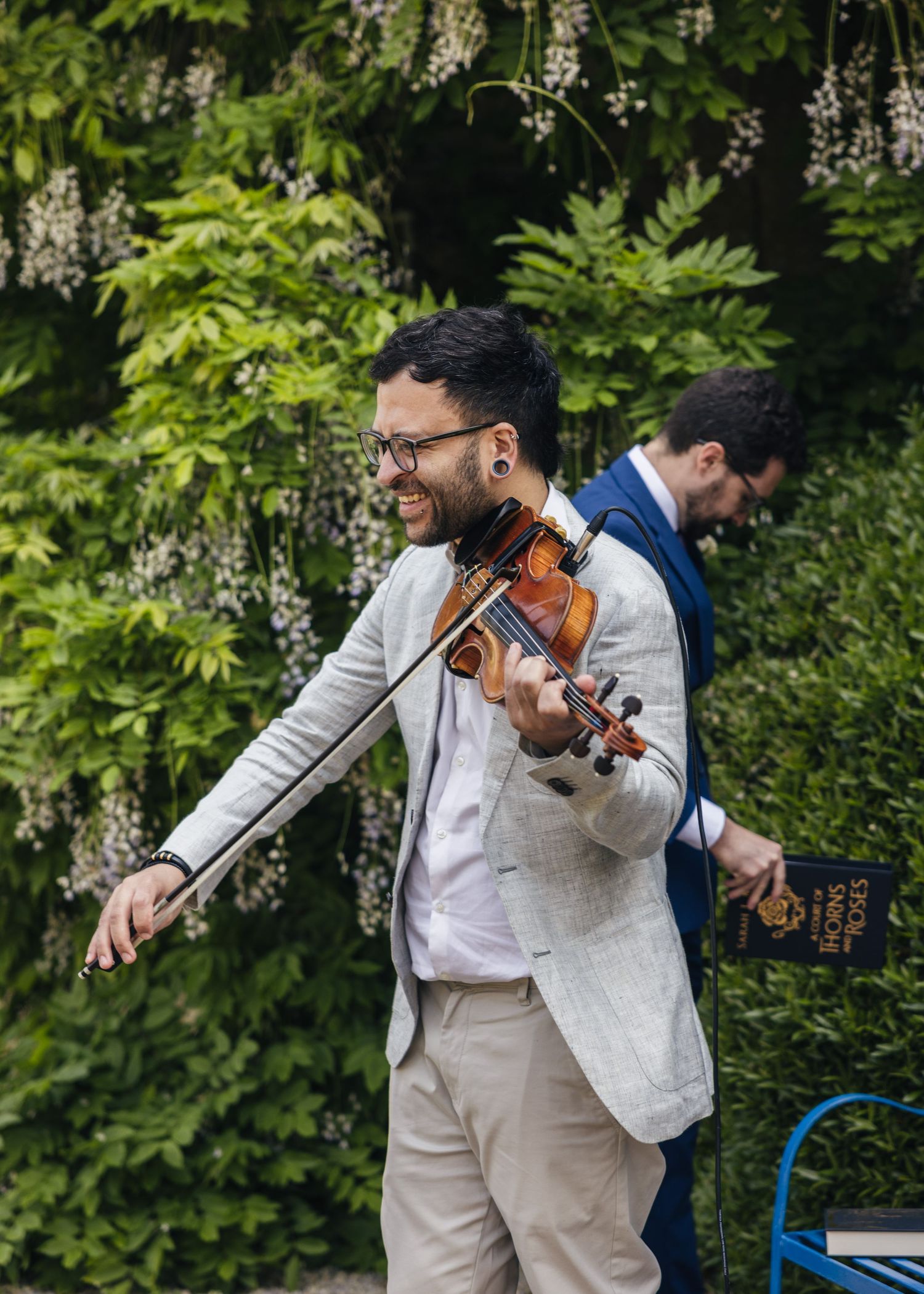 Outdoor wedding ceremony overlooking the Cotswold Hills at Kiftsgate Court Gardens
