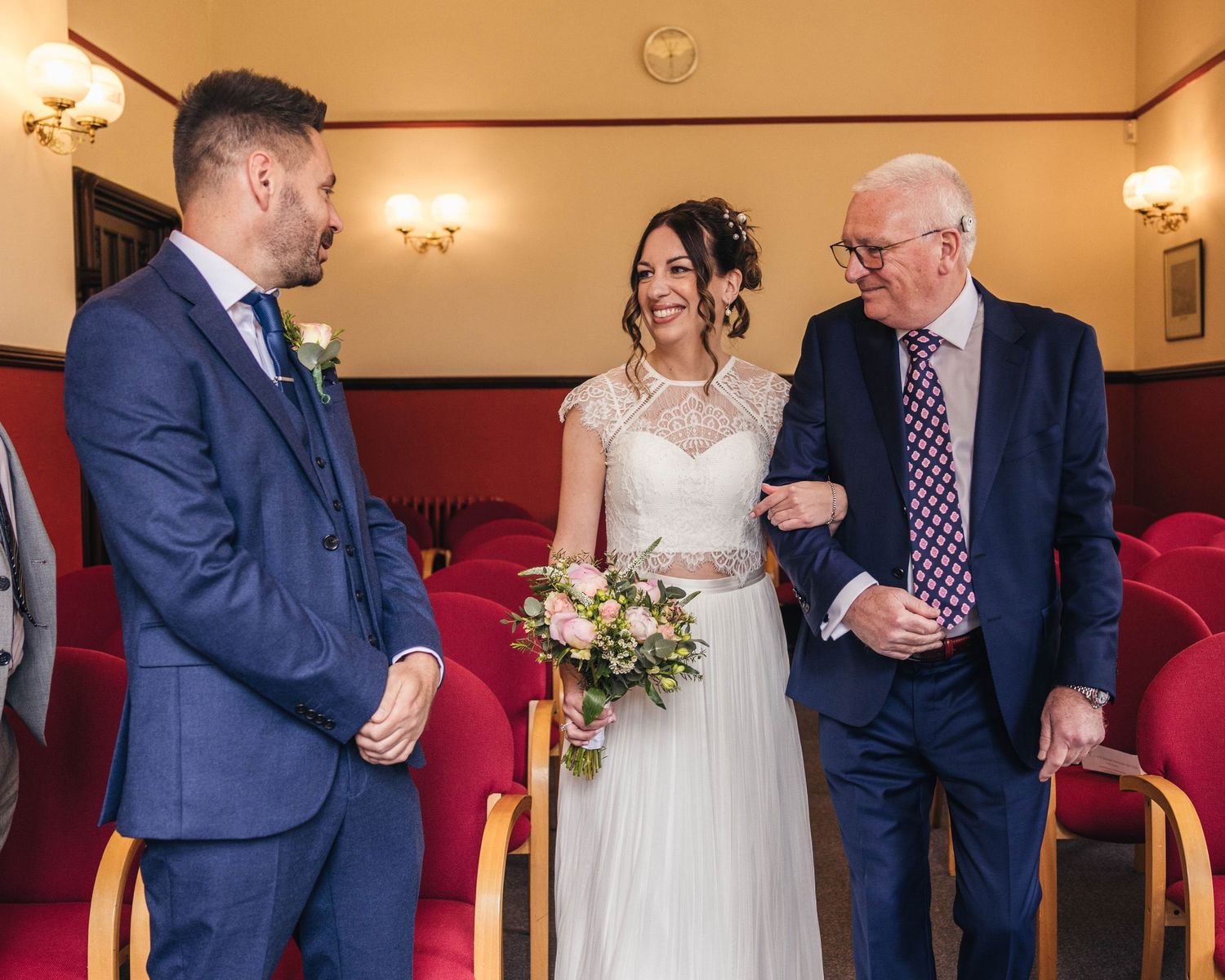 Bride and groom sharing a romantic moment on their wedding day, captured in a relaxed documentary style by EvieSJPhotography.