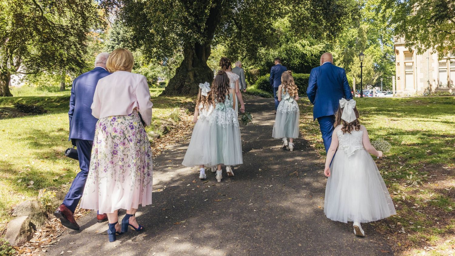 Bride and groom sharing a special moment with their family, captured in a relaxed documentary style by EvieSJPhotography.