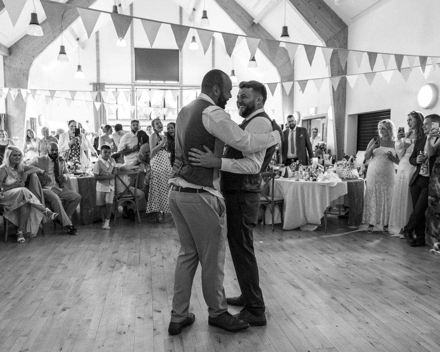 Jack and Aaron sharing a drunken embrace on the dance floor at Rock Village Hall in Worcestershire.