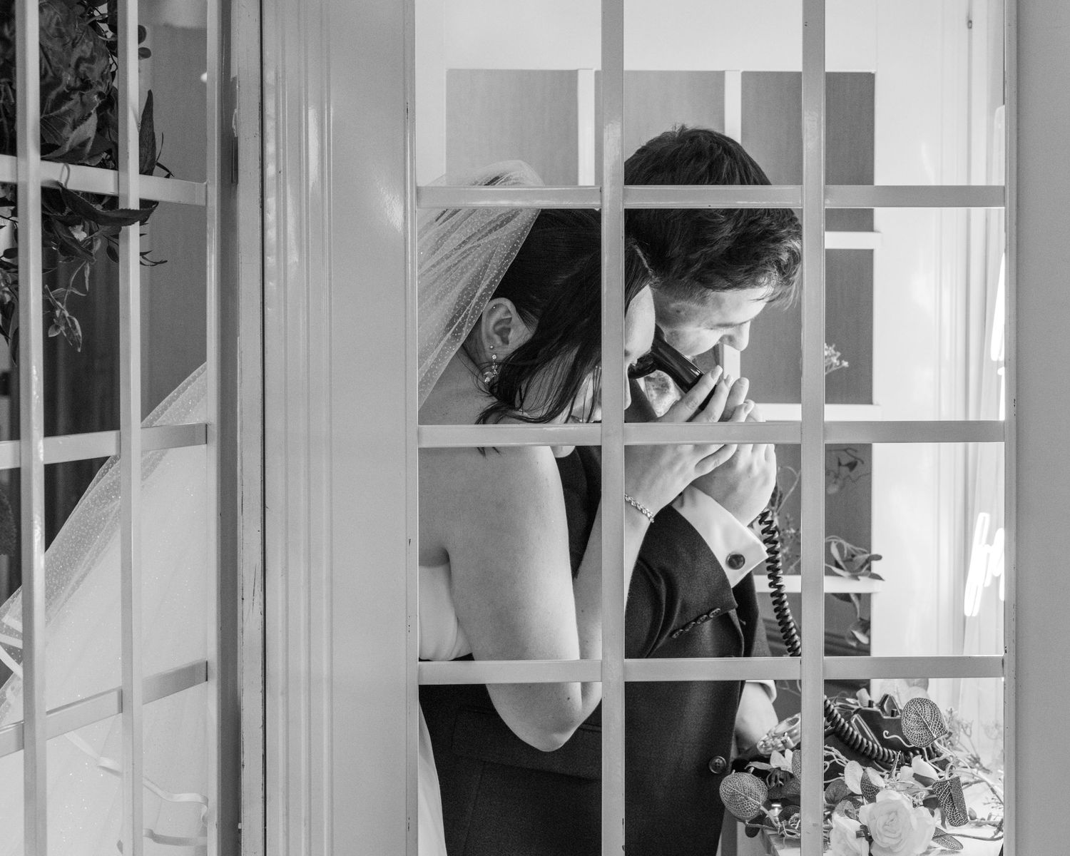 Cortney and Dan leaving a voicemail in a phone box for their future selves on their wedding day.