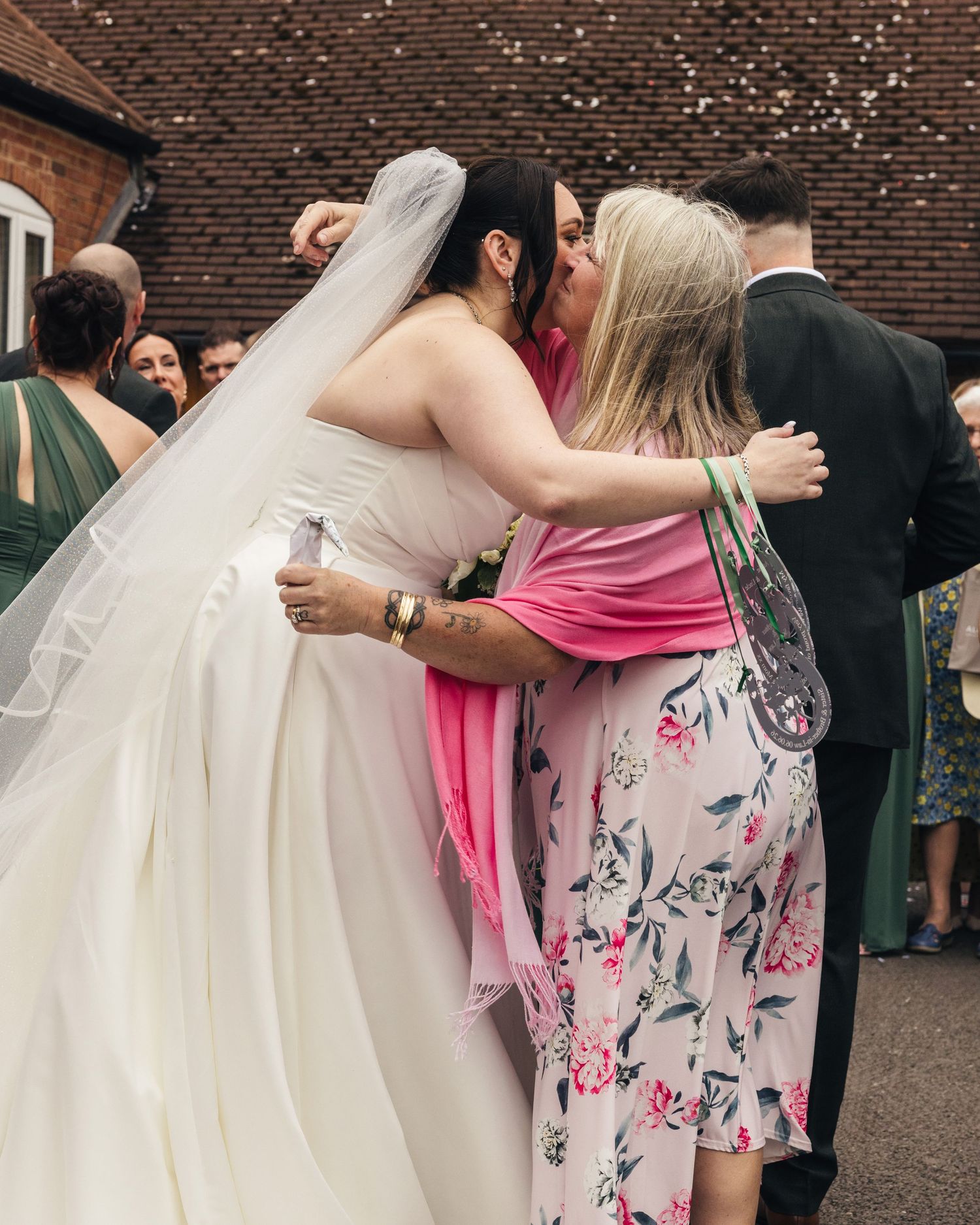Cortney shares a hug and kiss with a wedding guest during the celebrations.