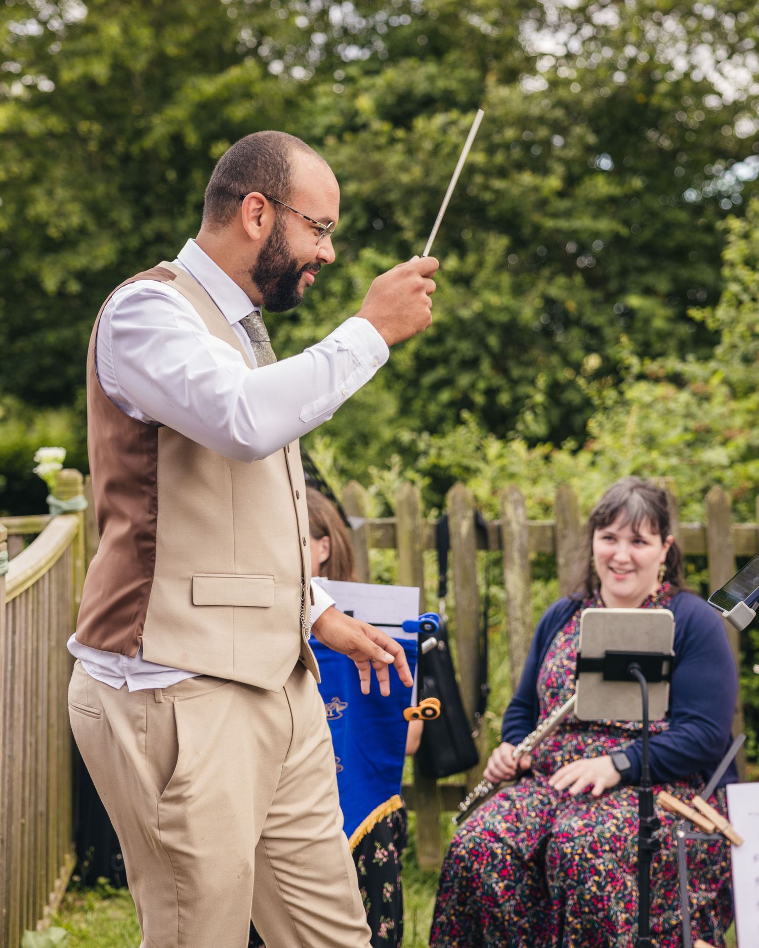 Aaron having a go at conducting an orchestra at Rock Village Hall.