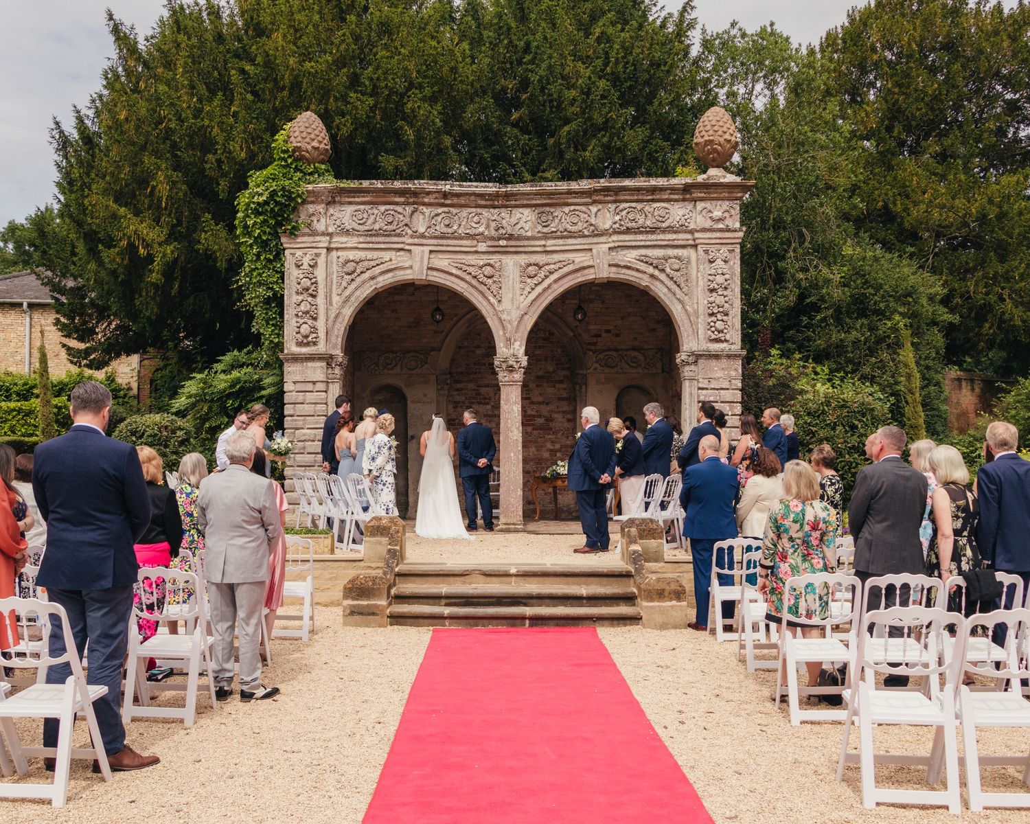 Bride and groom during their wedding ceremony, captured by EvieSJPhotography.