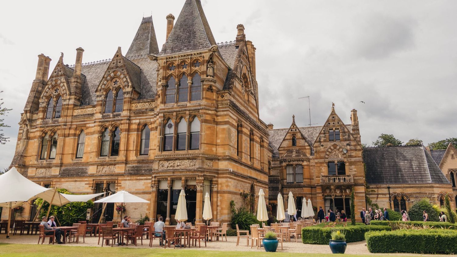 Ettington Park Hotel wedding venue captured in the sun by EvieSJPhotography.
