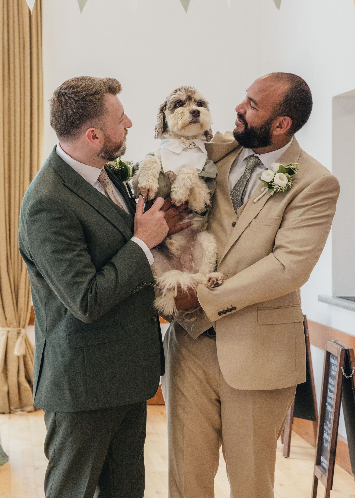 Aaron, Jack and their dog Milo just after their wedding ceremony posing for a family photo.