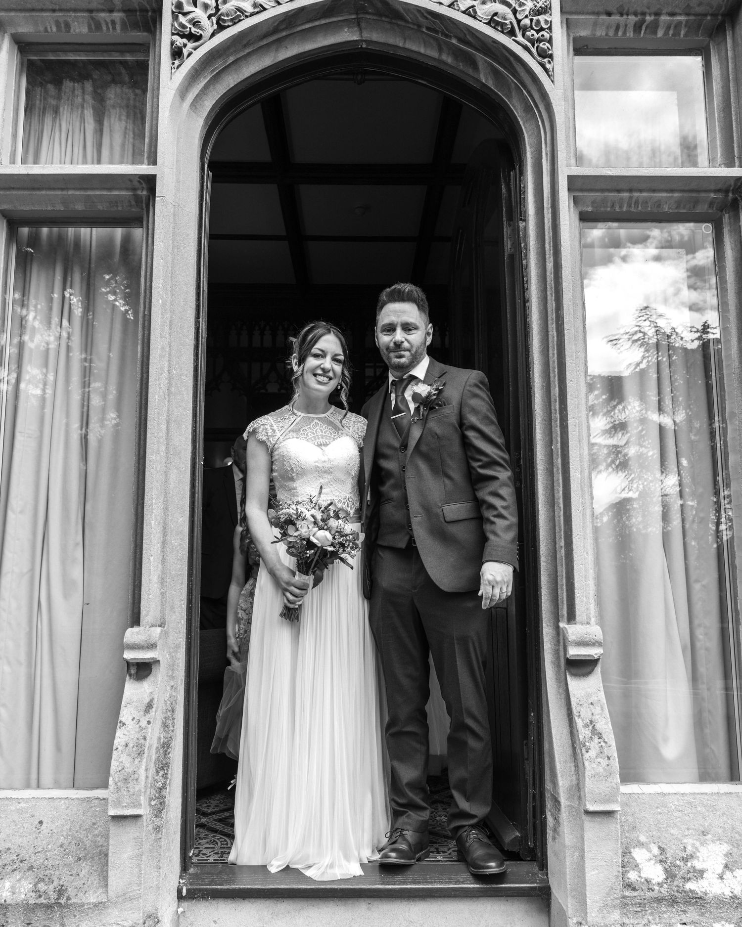 Bride and groom sharing a romantic moment post-ceremony, captured by EvieSJPhotography.