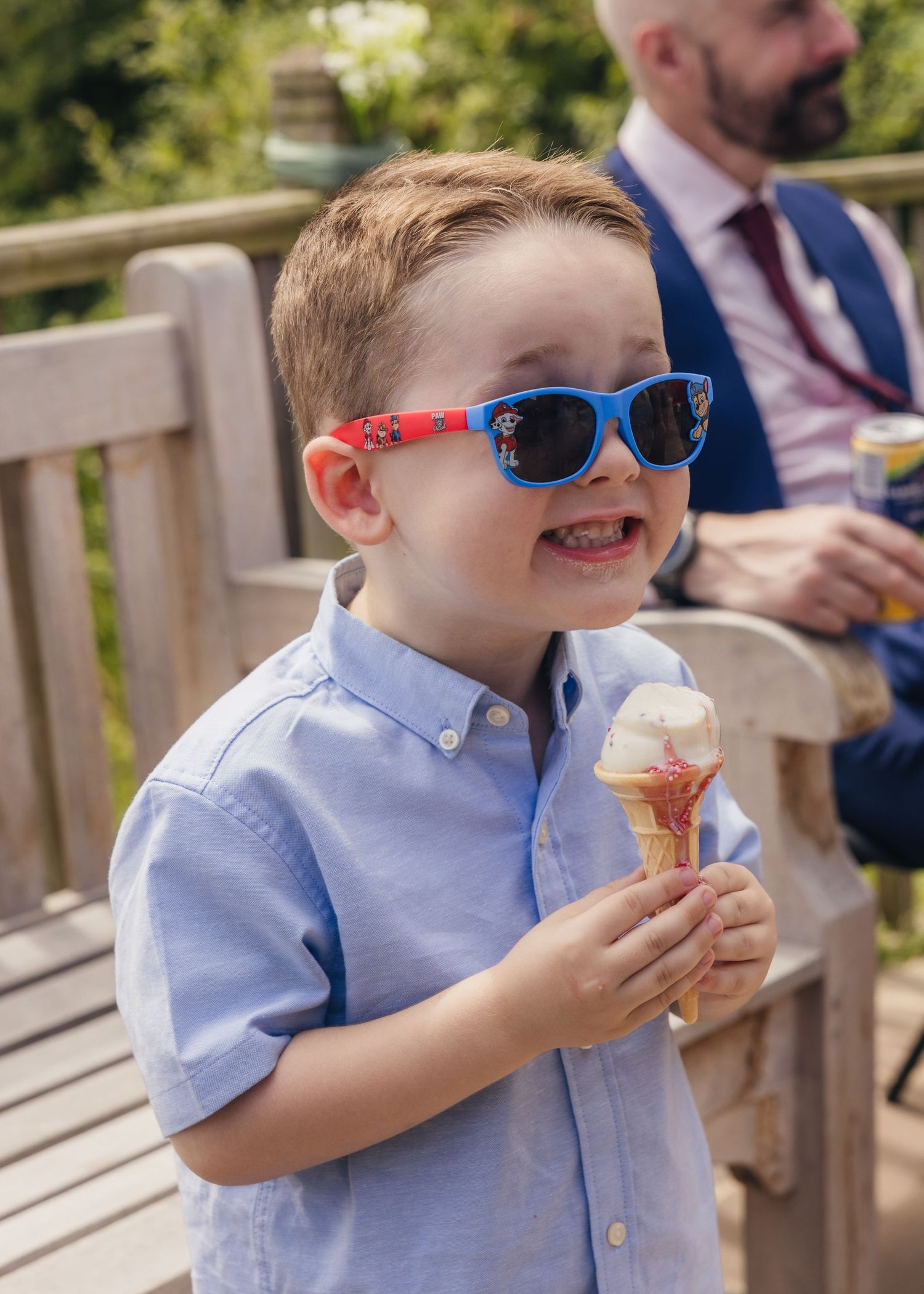 A young boy enjoying an ice cream on a hot summer's wedding day in Worcestershire.
