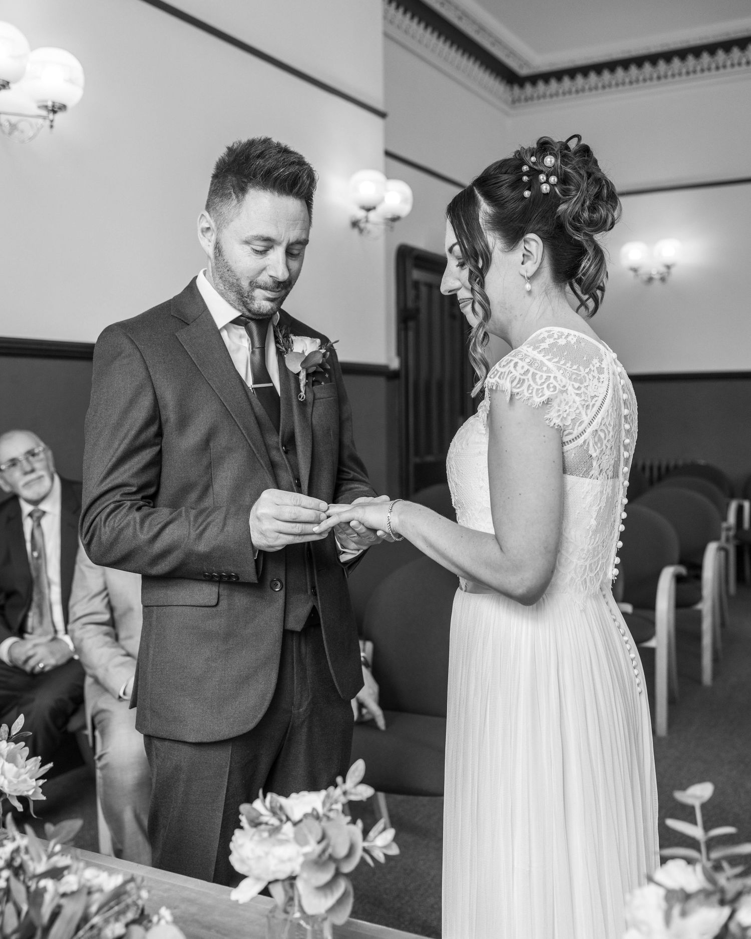 A bride and groom sharing a romantic moment during their ceremony, captured by EvieSJPhotography.
