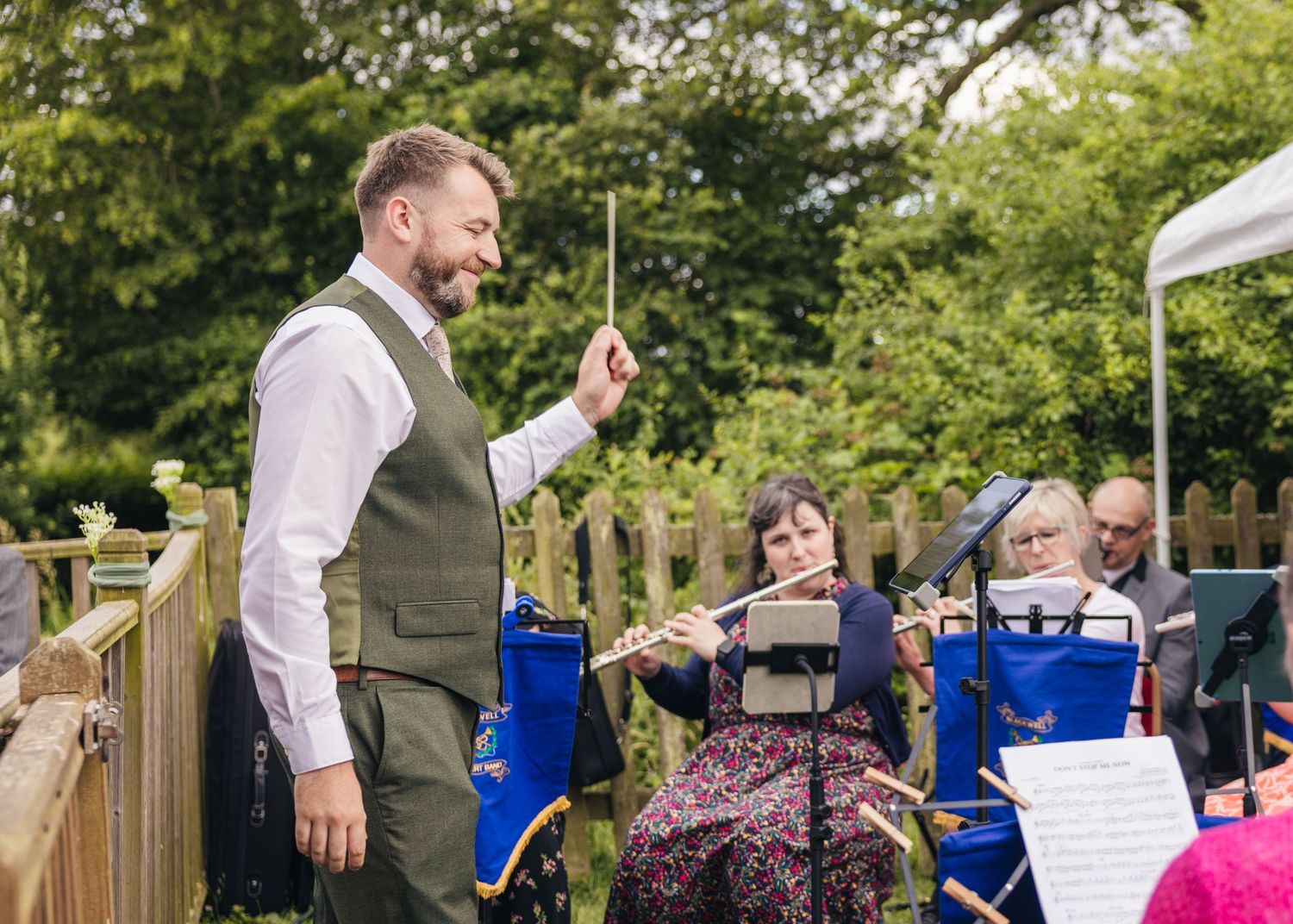 Jack conducting his orchestral band on his wedding day at Rock Village Hall.