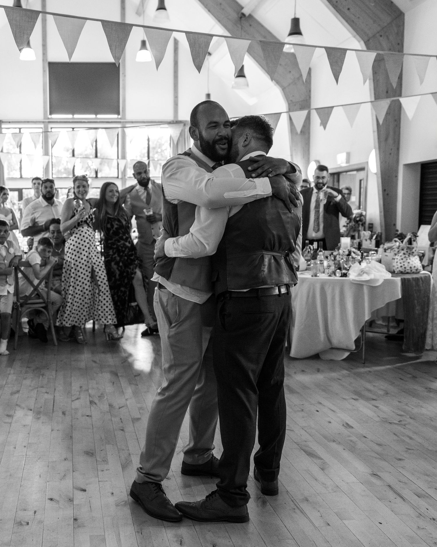 Jack and Aaron sharing a drunken embrace on the dance floor at Rock Village Hall in Worcestershire.