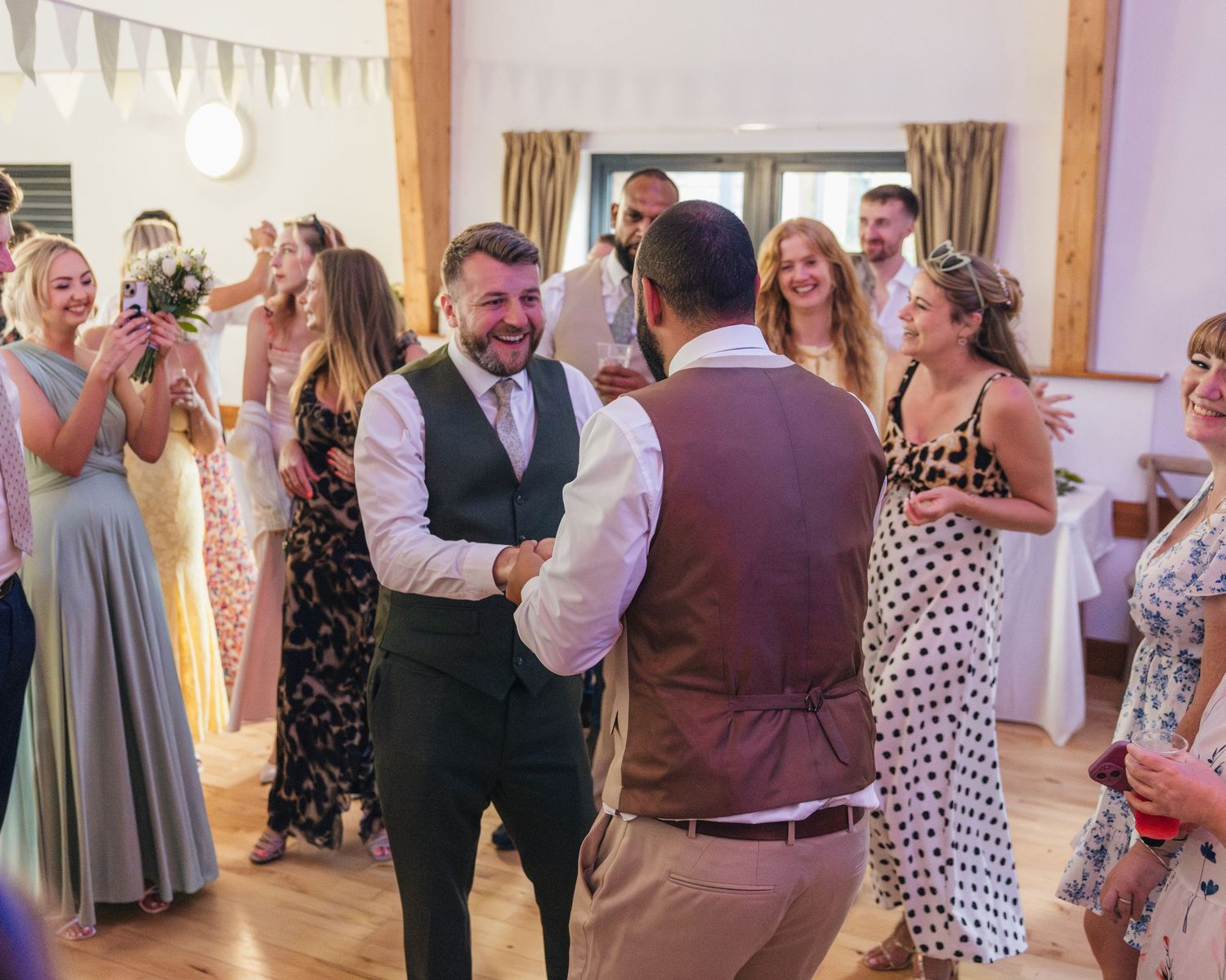 Jack and Aaron sharing a drunken embrace on the dance floor at Rock Village Hall in Worcestershire.