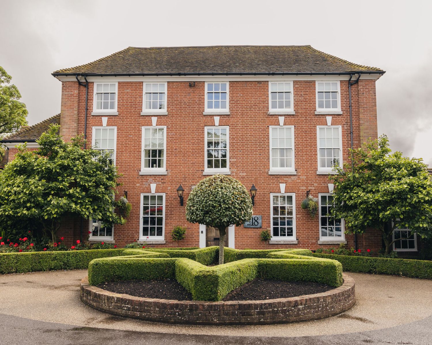 Exterior of Windmill Village Hotel in Coventry, a wedding venue surrounded by landscaped gardens.