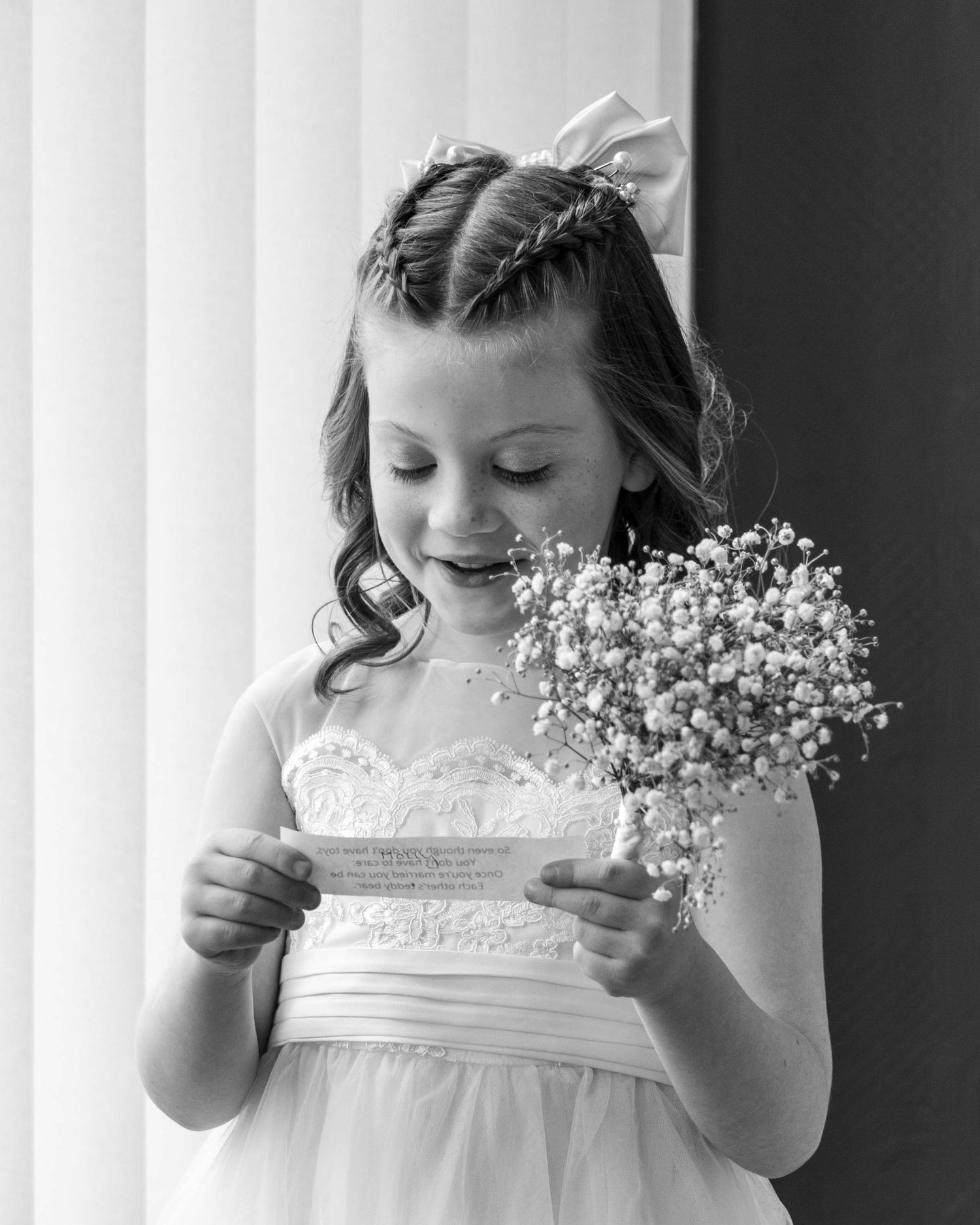 Bridesmaid reading a poem during the wedding ceremony, captured by EvieSJPhotography.